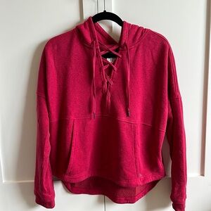 Red sweatshirt with front lace up.